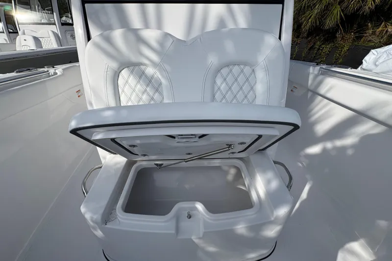  Yacht Photos Pics 2026 Sportsman Open 302 Center Console with open storage compartment and cushioned seating.