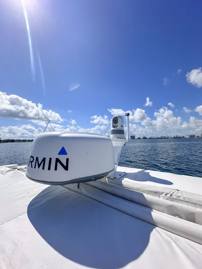Poly Yacht Photos Pics 2019 Regal 33 OBX boat with Garmin radar on a sunny day at sea.