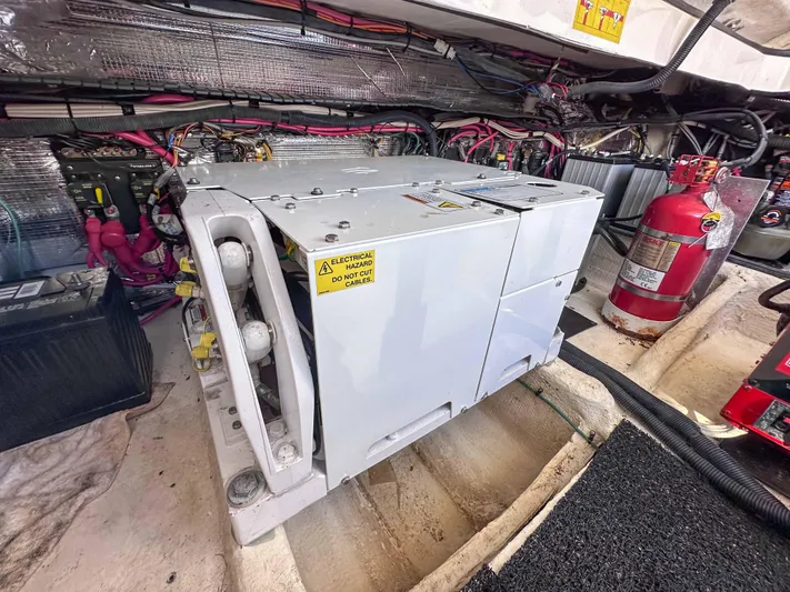 Poly Yacht Photos Pics Engine compartment of 2019 Regal 33 OBX with generator and fire extinguisher.