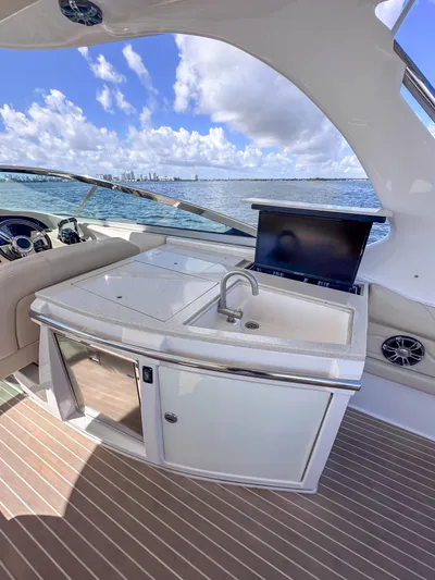 Poly Yacht Photos Pics 2019 Regal 33 OBX yacht interior with kitchenette and ocean view.