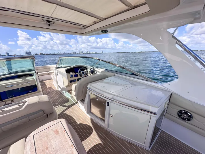 Poly Yacht Photos Pics 2019 Regal 33 OBX boat interior with luxurious seating and ocean view.