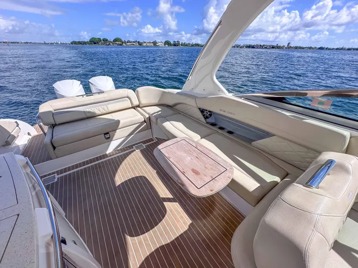 Poly Yacht Photos Pics 2019 Regal 33 OBX boat interior with luxurious seating and ocean view.