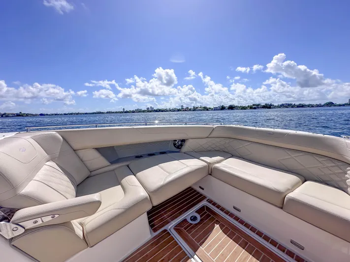 Poly Yacht Photos Pics Luxurious seating on 2019 Regal 33 OBX boat with scenic ocean view.