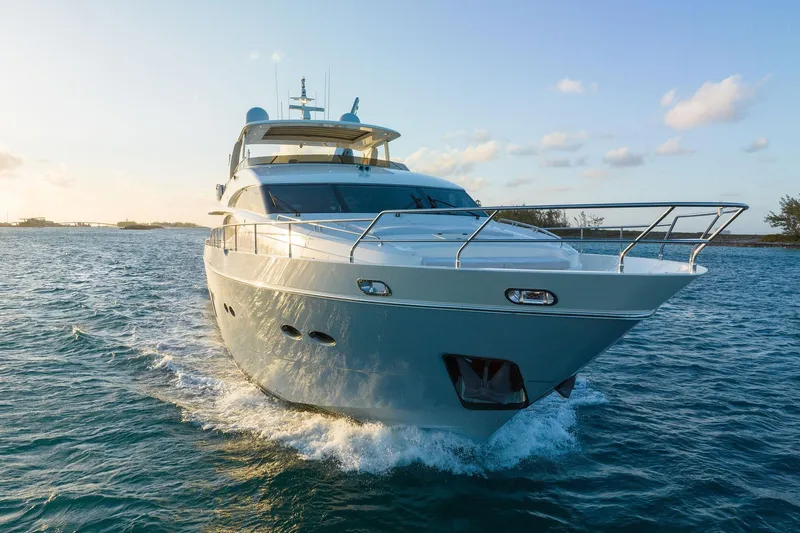 Current Sea Yacht Photos Pics Luxurious 2011 Princess 95 yacht cruising on open water at sunset.