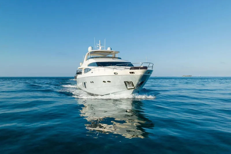 Current Sea Yacht Photos Pics Luxurious 2011 Princess 95 yacht cruising on calm blue ocean waters.