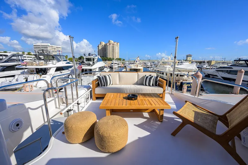 Time Off V Yacht Photos Pics Luxurious 2005 Lazzara 68 Enclosed Bridge yacht with elegant outdoor seating at marina.