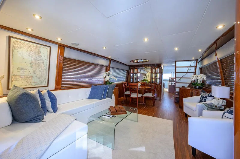 Time Off V Yacht Photos Pics Luxurious interior of 2005 Lazzara 68 Enclosed Bridge yacht with elegant seating and dining area.