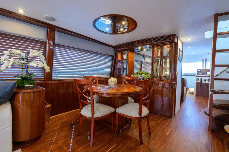 Time Off V Yacht Photos Pics Luxurious interior of 2005 Lazzara 68 Enclosed Bridge yacht with elegant wood finishes.