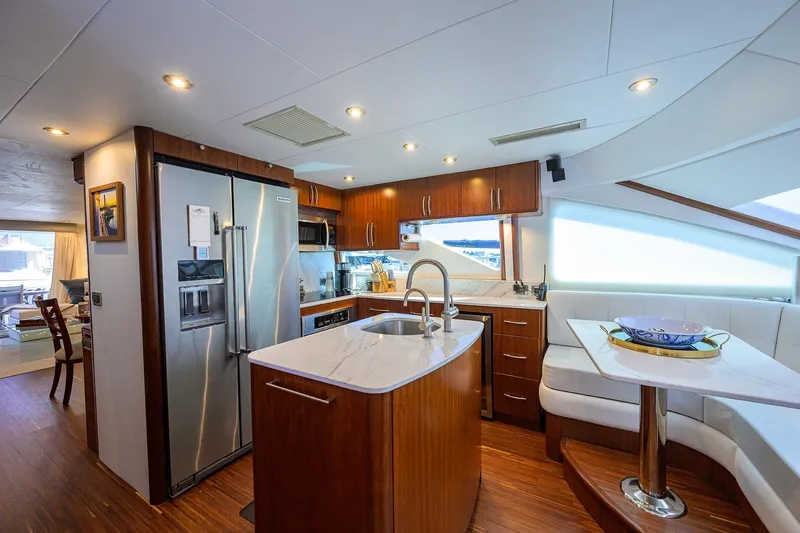 Time Off V Yacht Photos Pics Luxurious kitchen interior of 2005 Lazzara 68 Enclosed Bridge yacht with modern amenities.