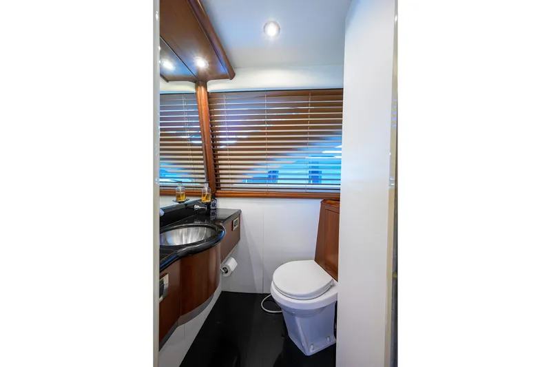 Time Off V Yacht Photos Pics Luxurious bathroom in 2005 Lazzara 68 Enclosed Bridge yacht with modern fixtures.
