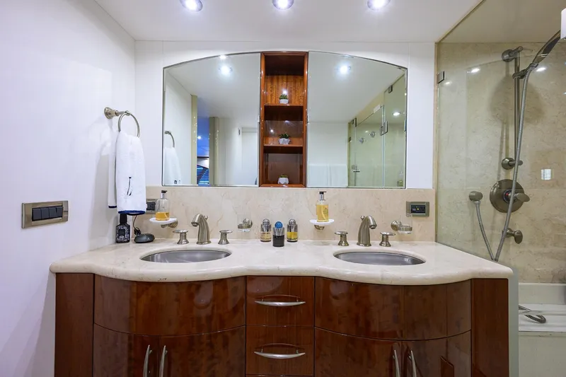 Time Off V Yacht Photos Pics Luxurious bathroom in 2005 Lazzara 68 Enclosed Bridge yacht with dual sinks and elegant fixtures.