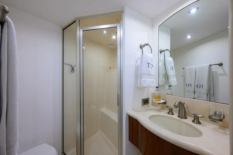 Time Off V Yacht Photos Pics Luxurious bathroom in 2005 Lazzara 68 Enclosed Bridge yacht with shower and elegant fixtures.