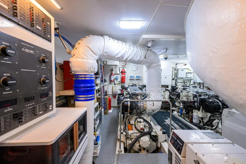 Time Off V Yacht Photos Pics Engine room of 2005 Lazzara 68 Enclosed Bridge yacht, featuring control panels and machinery.