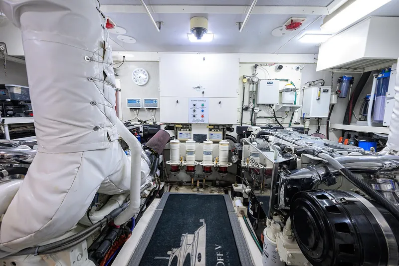 Time Off V Yacht Photos Pics Engine room of 2005 Lazzara 68 Enclosed Bridge yacht, showcasing machinery and equipment.