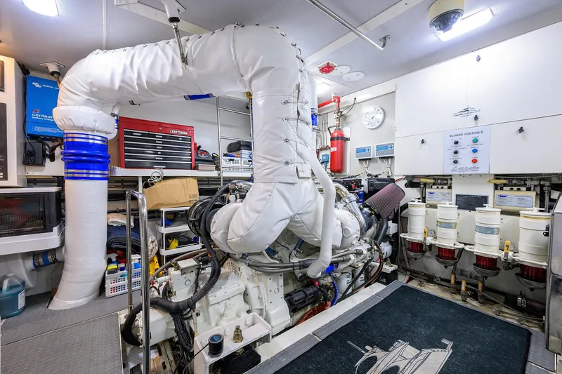 Time Off V Yacht Photos Pics Engine room of 2005 Lazzara 68 Enclosed Bridge yacht, featuring complex machinery and equipment.