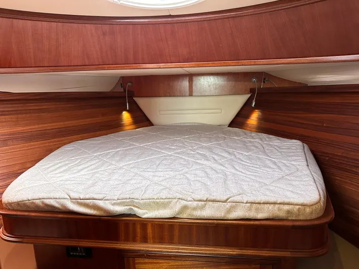 San Juan Yacht Photos Pics 2015 San Juan 41 boat cabin with wooden interior and cozy bed.
