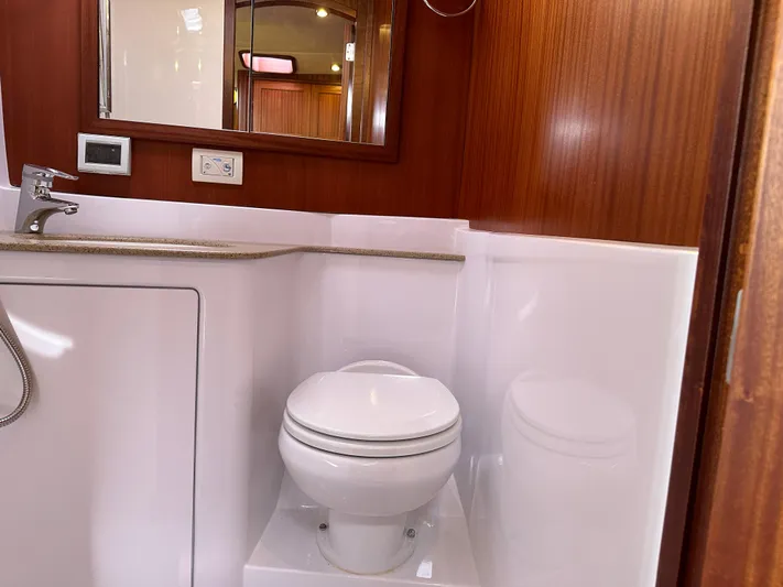 San Juan Yacht Photos Pics San Juan 41 2015 yacht bathroom with toilet, sink, and mirror.