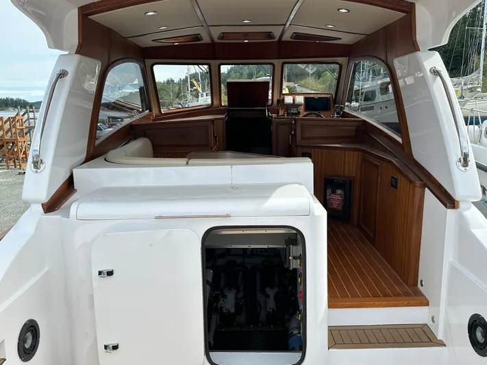 San Juan Yacht Photos Pics Interior of 2015 San Juan 41 boat with wooden accents and open engine compartment.
