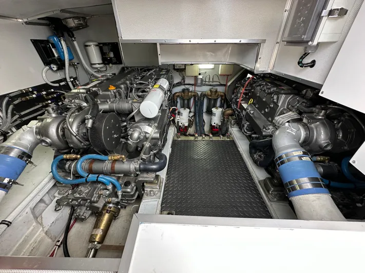 San Juan Yacht Photos Pics Engine room of a 2015 San Juan 41 boat with dual engines and mechanical components.