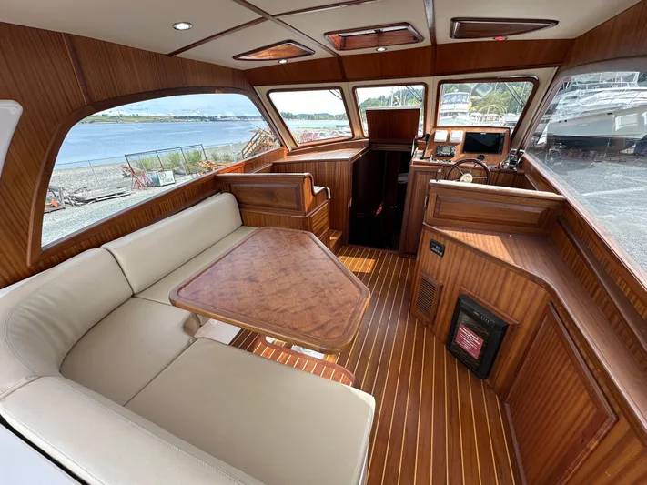 San Juan Yacht Photos Pics Luxurious interior of 2015 San Juan 41 yacht with wood finish and waterfront view.