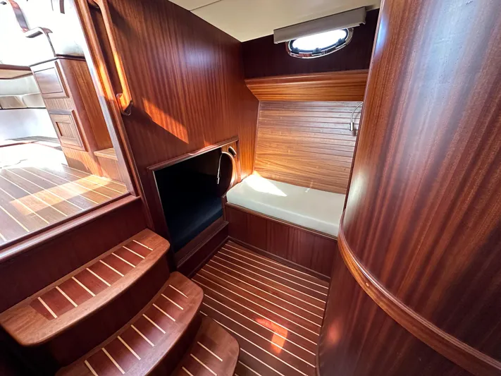 San Juan Yacht Photos Pics Luxurious wooden interior of 2015 San Juan 41 yacht with steps and seating area.