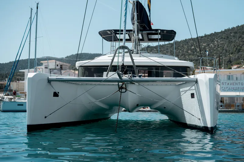  Yacht Photos Pics 2018 Lagoon 52 F catamaran docked in a marina, front view.