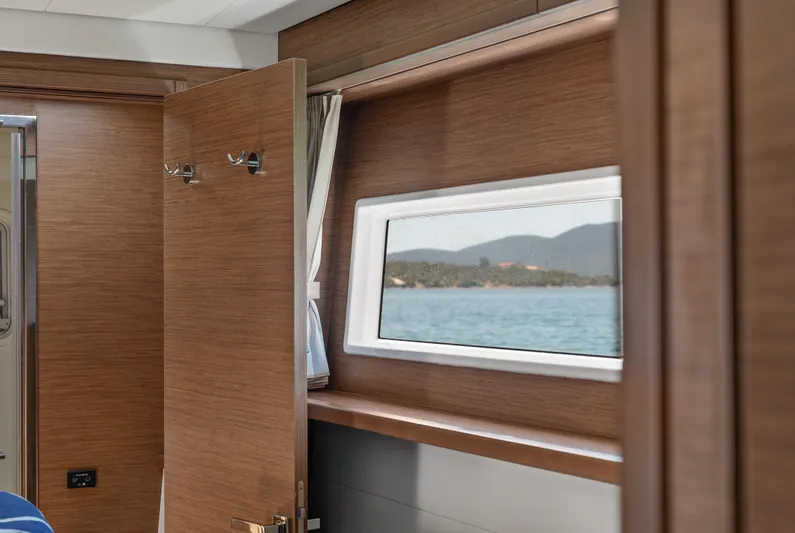  Yacht Photos Pics Interior of 2018 Lagoon 52 F yacht with wooden finish and sea view window.