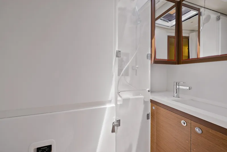  Yacht Photos Pics Modern bathroom in 2018 Lagoon 52 F yacht with sleek fixtures and wooden cabinetry.