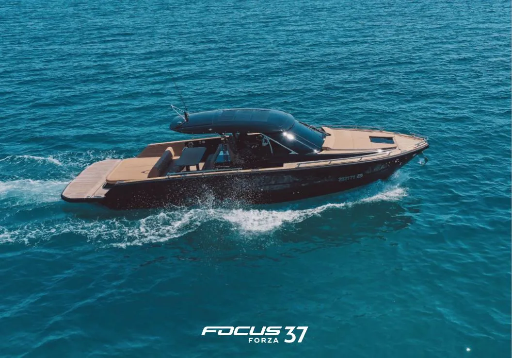 2025 Focus Forza 37 boat cruising on clear blue ocean waters.