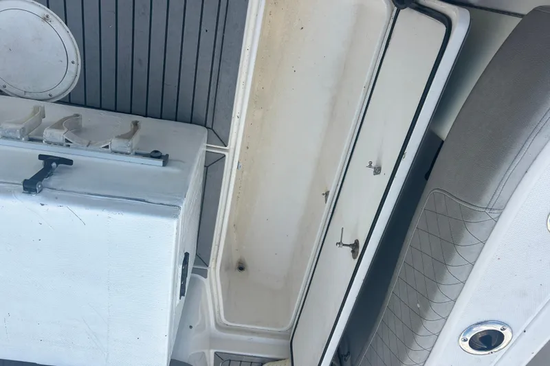  Yacht Photos Pics 2007 Fountain 38 Sportfish Cruiser OB interior with storage compartments and seating.