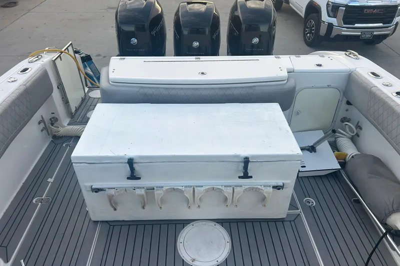  Yacht Photos Pics 2007 Fountain 38 Sportfish Cruiser OB deck with storage box and outboard motors.