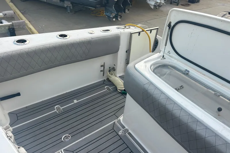  Yacht Photos Pics 2007 Fountain 38 Sportfish Cruiser OB interior with cushioned seating and storage compartments.