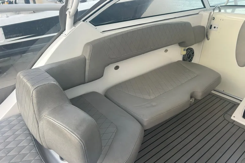  Yacht Photos Pics 2007 Fountain 38 Sportfish Cruiser OB interior with gray cushioned seating and sleek design.