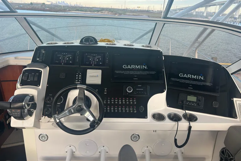  Yacht Photos Pics Helm of 2007 Fountain 38 Sportfish Cruiser OB with Garmin navigation displays.
