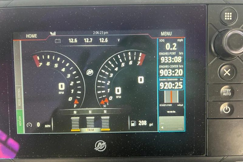  Yacht Photos Pics Dashboard of a 2007 Fountain 38 Sportfish Cruiser OB showing engine metrics and controls.