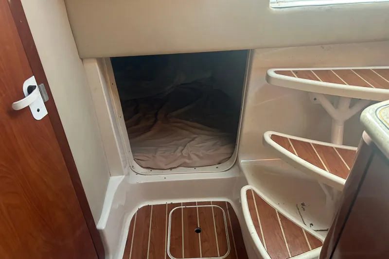  Yacht Photos Pics Interior cabin view of 2007 Fountain 38 Sportfish Cruiser OB with wooden steps.