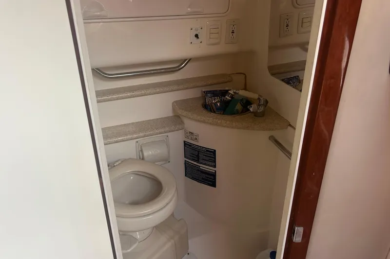  Yacht Photos Pics 2007 Fountain 38 Sportfish Cruiser OB bathroom with toilet and sink.