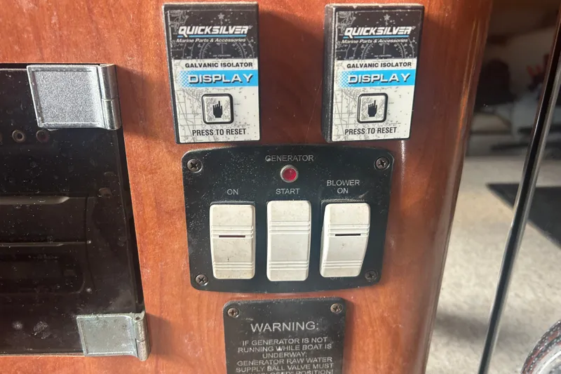  Yacht Photos Pics Control panel of a 2007 Fountain 38 Sportfish Cruiser OB with generator switches.