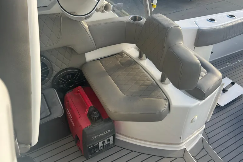  Yacht Photos Pics 2007 Fountain 38 Sportfish Cruiser OB interior with seating and Honda generator.