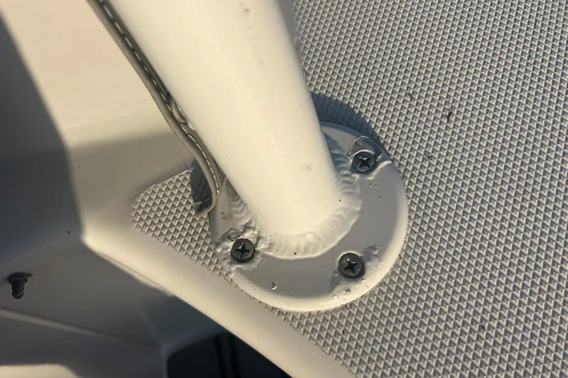  Yacht Photos Pics Close-up of a 2007 Fountain 38 Sportfish Cruiser OB boat's metal fixture with screws.