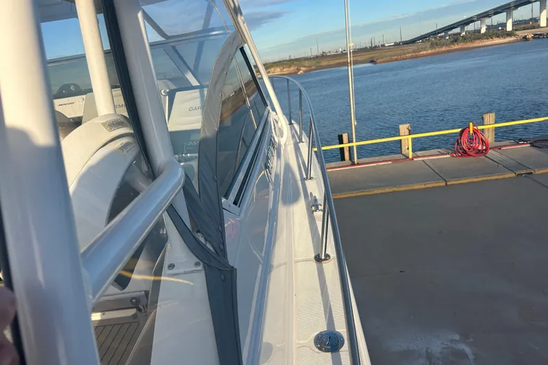  Yacht Photos Pics 2007 Fountain 38 Sportfish Cruiser OB docked by the water, showcasing sleek design.