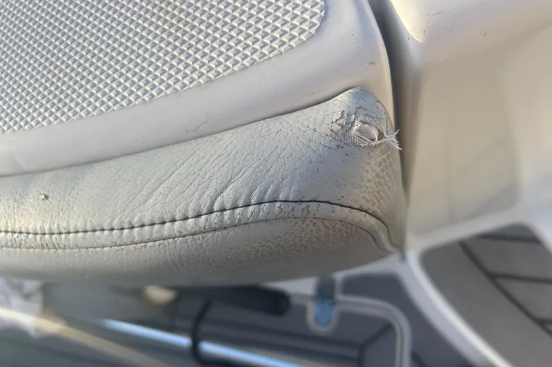  Yacht Photos Pics Close-up of worn upholstery on a 2007 Fountain 38 Sportfish Cruiser OB.