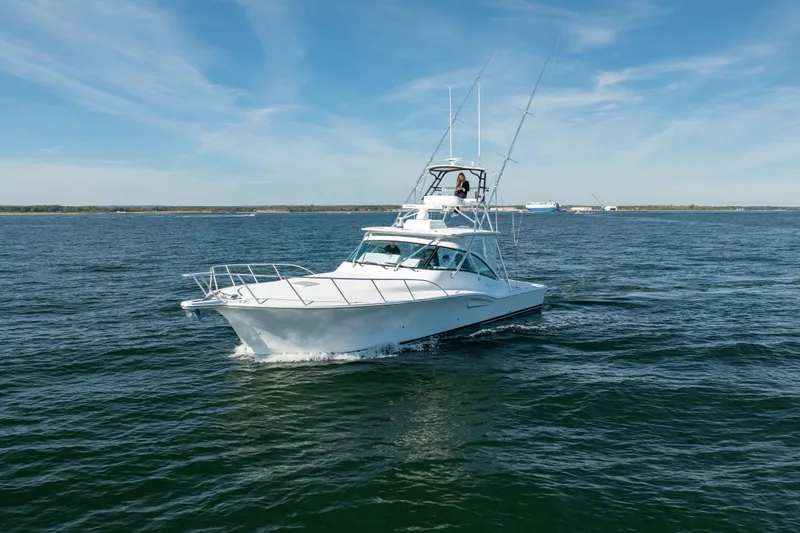 Salt Lick Yacht Photos Pics 2018 Albemarle 41 Express yacht cruising on open water under clear skies.