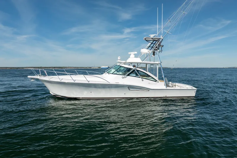 Salt Lick Yacht Photos Pics 2018 Albemarle 41 Express boat on open water under clear blue sky.