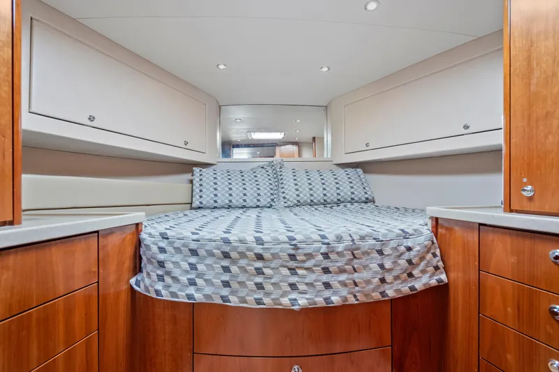 Salt Lick Yacht Photos Pics 2018 Albemarle 41 Express cabin interior with bed, wooden cabinetry, and modern design.