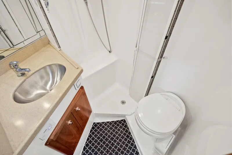 Salt Lick Yacht Photos Pics 2018 Albemarle 41 Express yacht bathroom with sink, toilet, and shower.