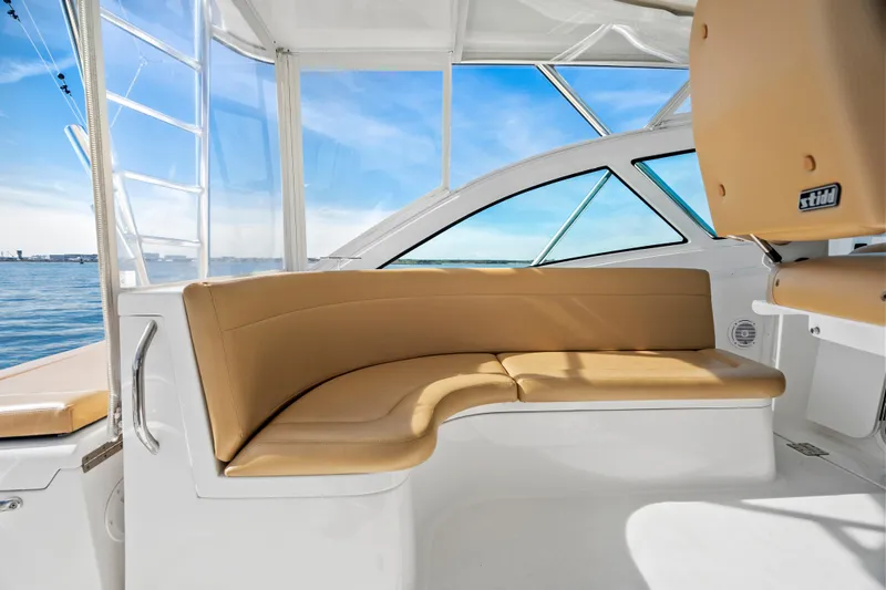 Salt Lick Yacht Photos Pics 2018 Albemarle 41 Express boat interior with tan seating and ocean view.