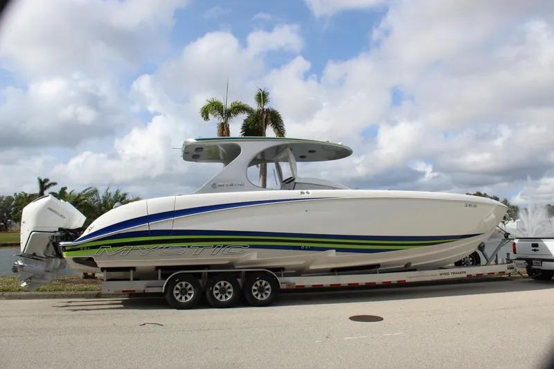  Yacht Photos Pics 2020 Mystic Powerboats M4200 on trailer, sleek design with vibrant accents.