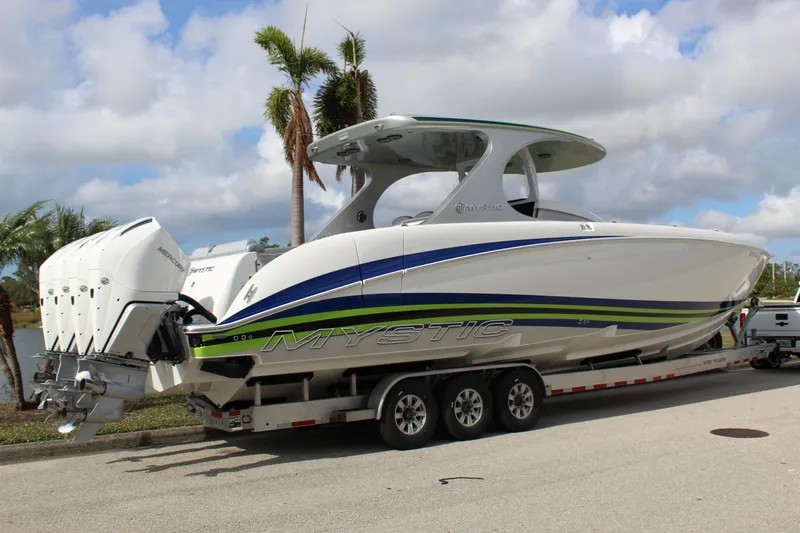  Yacht Photos Pics 2020 Mystic Powerboats M4200 on trailer, sleek design with triple engines.