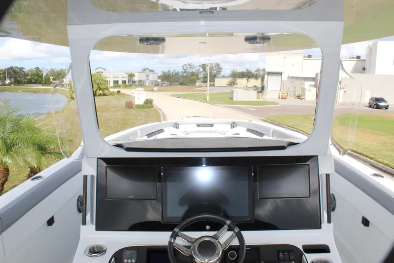  Yacht Photos Pics 2020 Mystic Powerboats M4200 helm with modern dashboard and steering wheel.